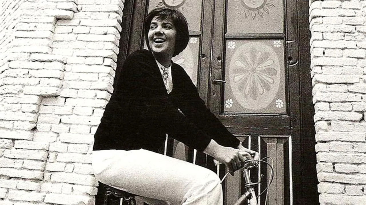 Një Vajzë Qesharake backdrop