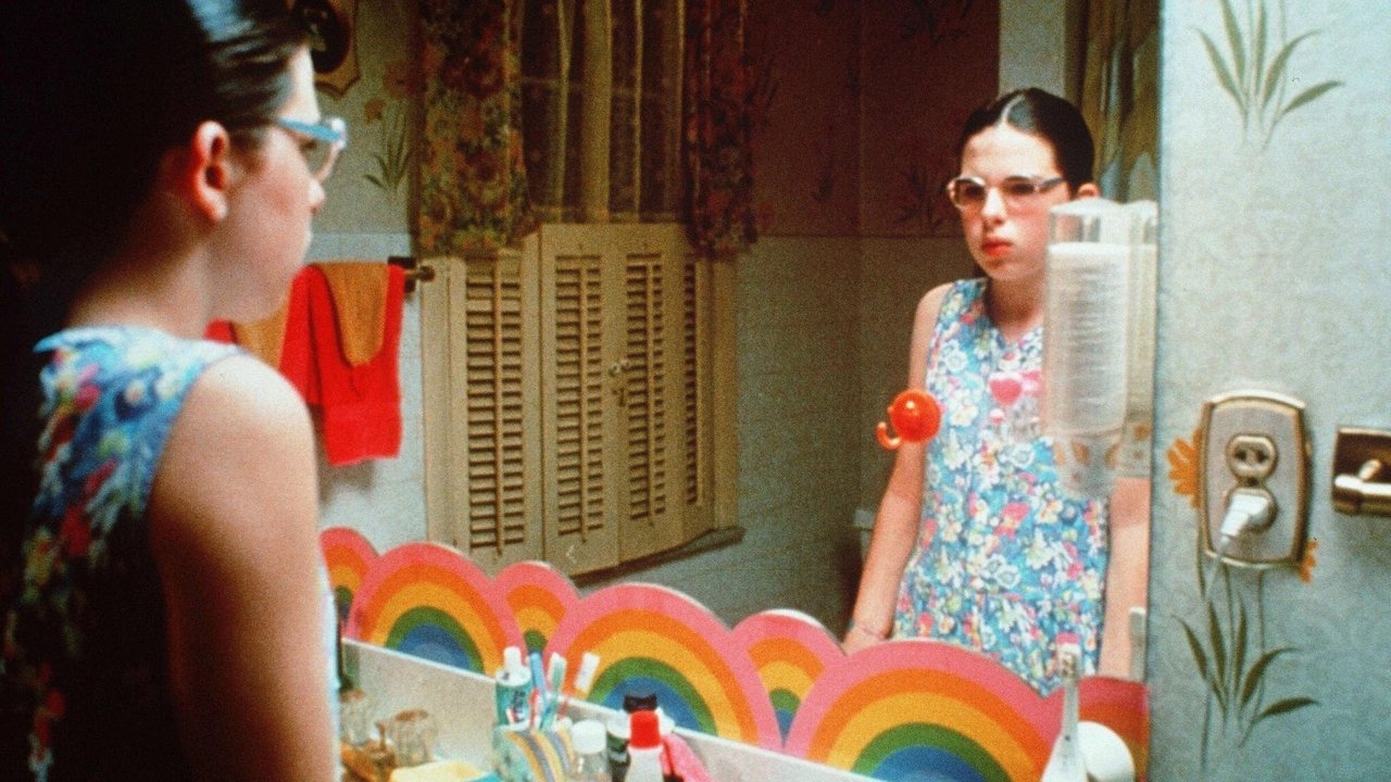 E Vërteta e Zhveshur backdrop