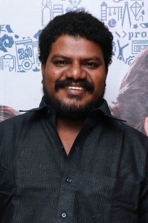Aadukalam Murugadoss backdrop