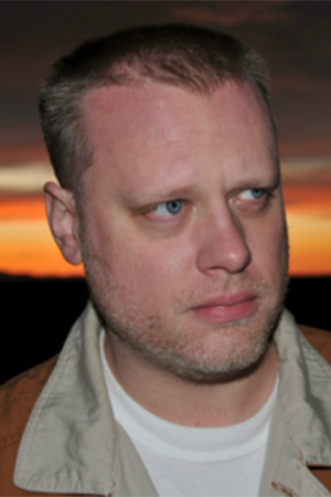 Joshua P. Warren backdrop