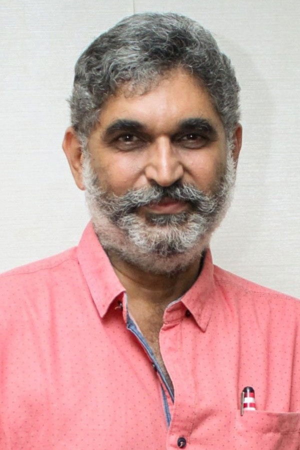 Suresh Chandra Menon backdrop