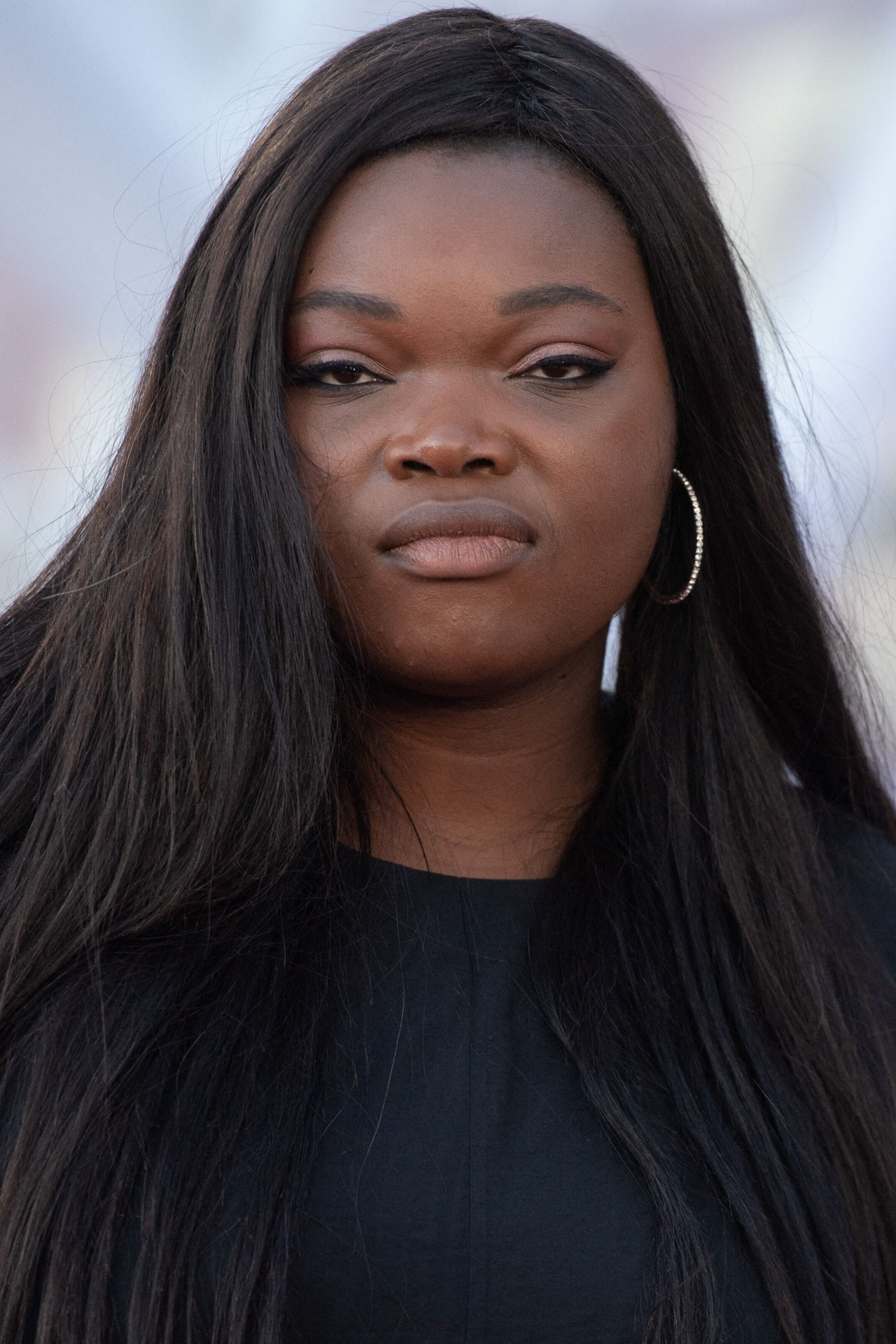 Guslagie Malanda backdrop