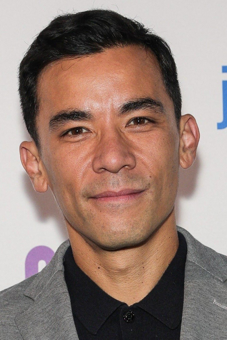 Conrad Ricamora backdrop