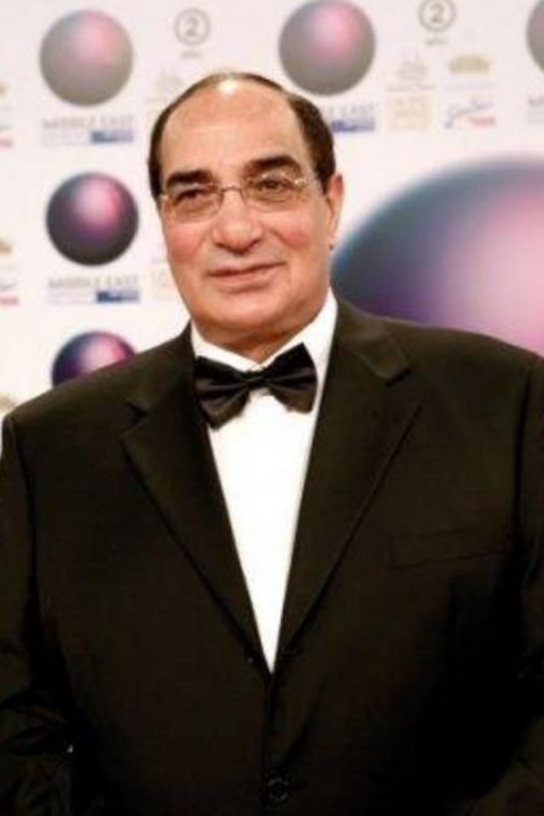 Magdy Ahmed Aly backdrop