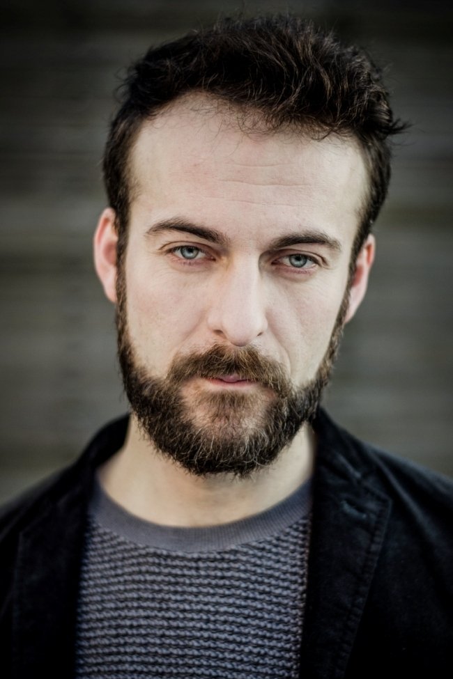 Łukasz Wójcik backdrop