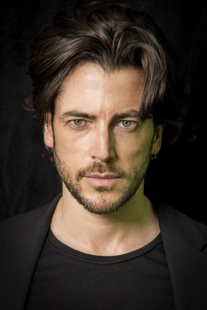 Ángel de Miguel backdrop