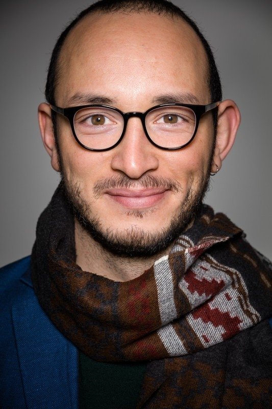 Majd Mastoura backdrop