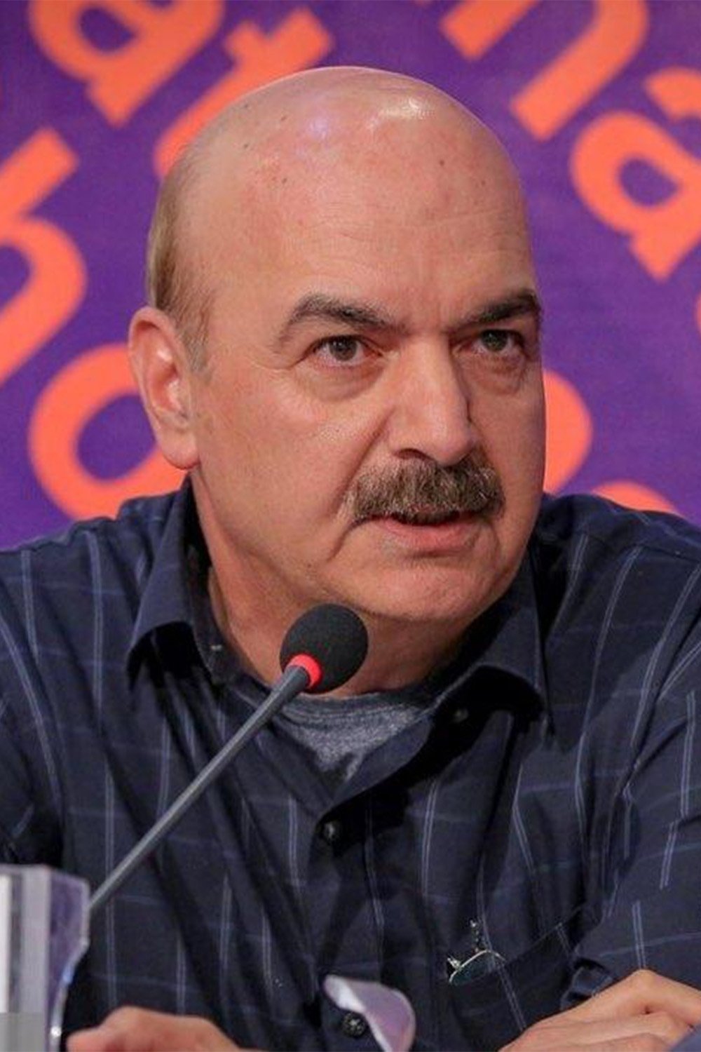 Iraj Tahmasb backdrop