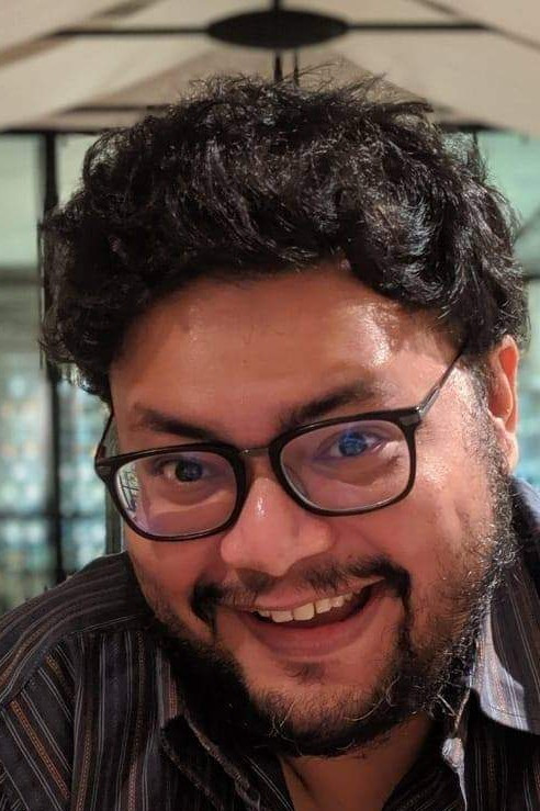 Pratim D. Gupta backdrop