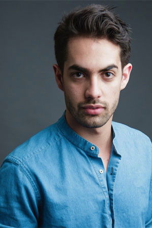 Juan Carlos Huguenin backdrop