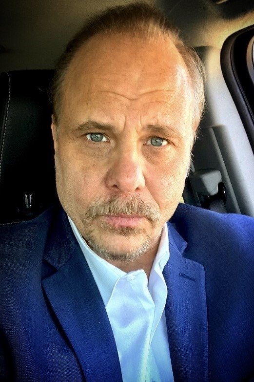 Dennis W. Hall backdrop