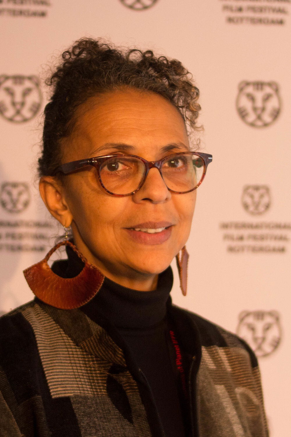 Shirikiana Aina backdrop