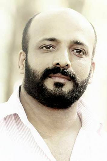 M B Padmakumar backdrop