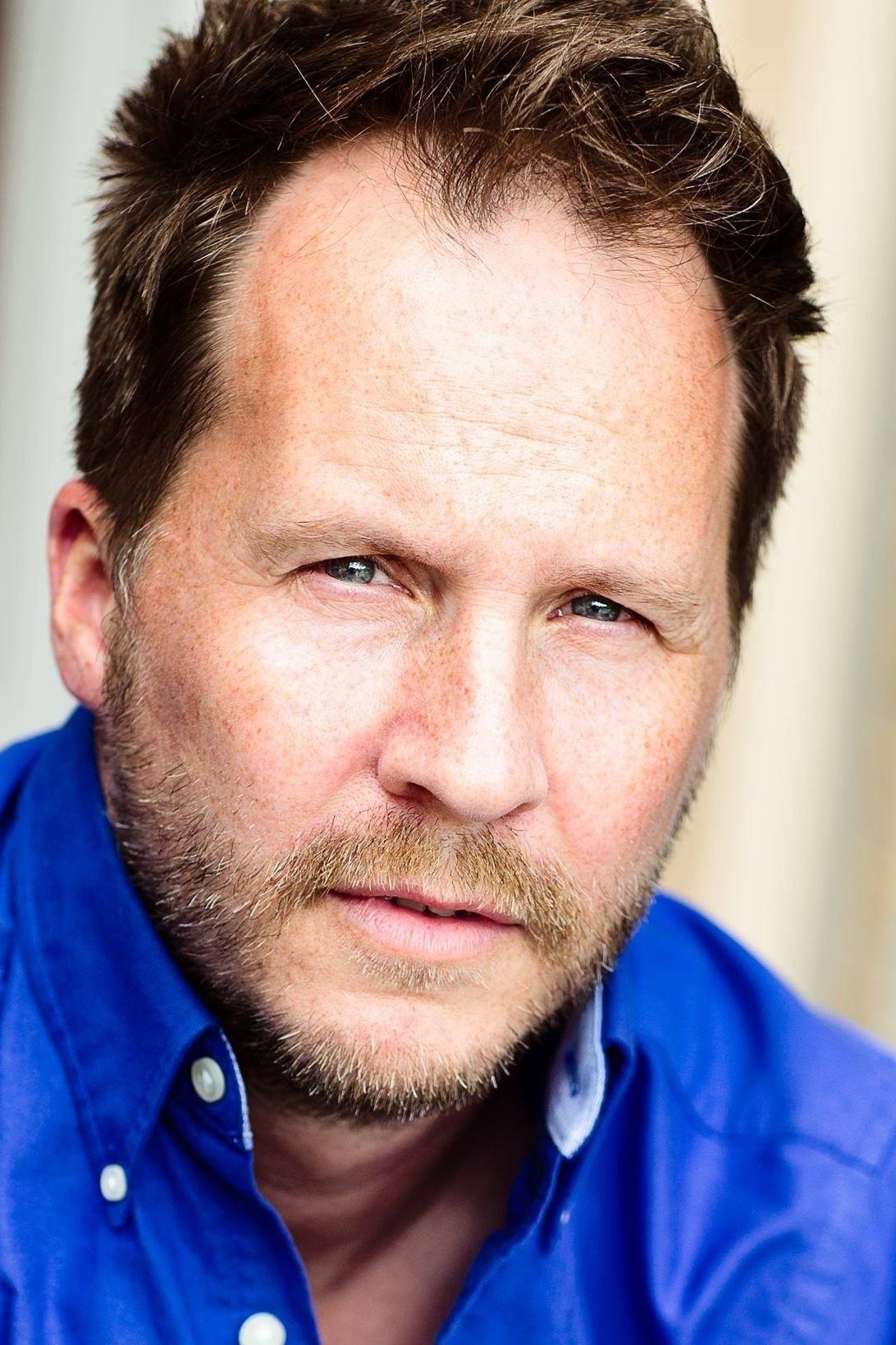 Greg J. Wolfe backdrop