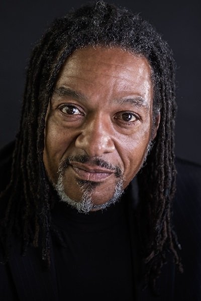 Xhejm R. Bejlis backdrop