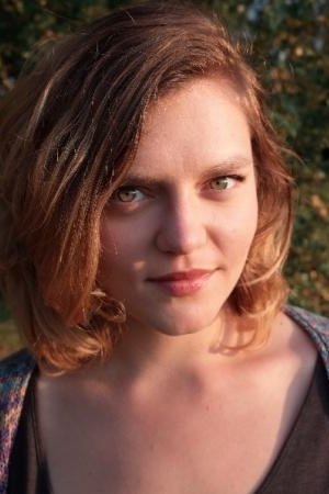 Adéla Komrzý backdrop