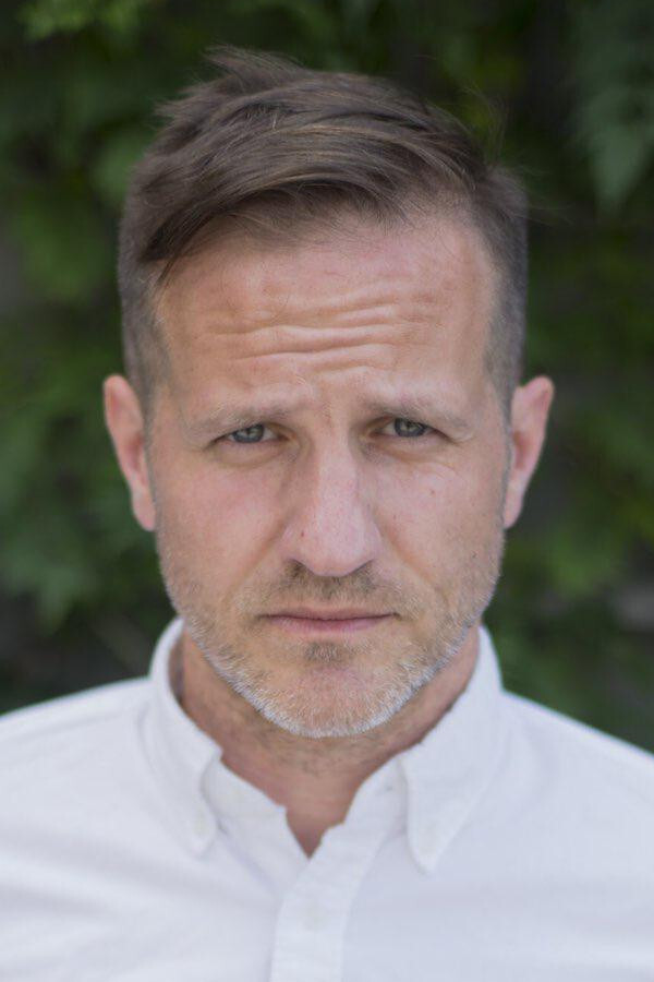 Michael C. Moynihan backdrop