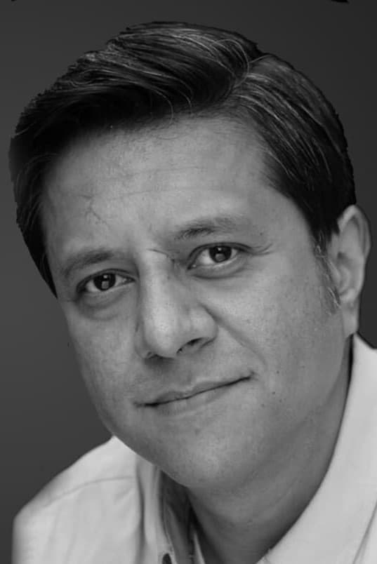 Ravin J. Ganatra backdrop