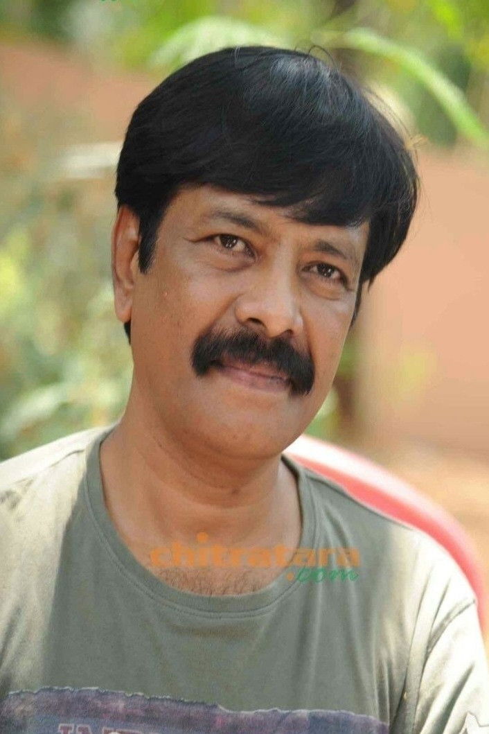 Dharmendra Urs backdrop