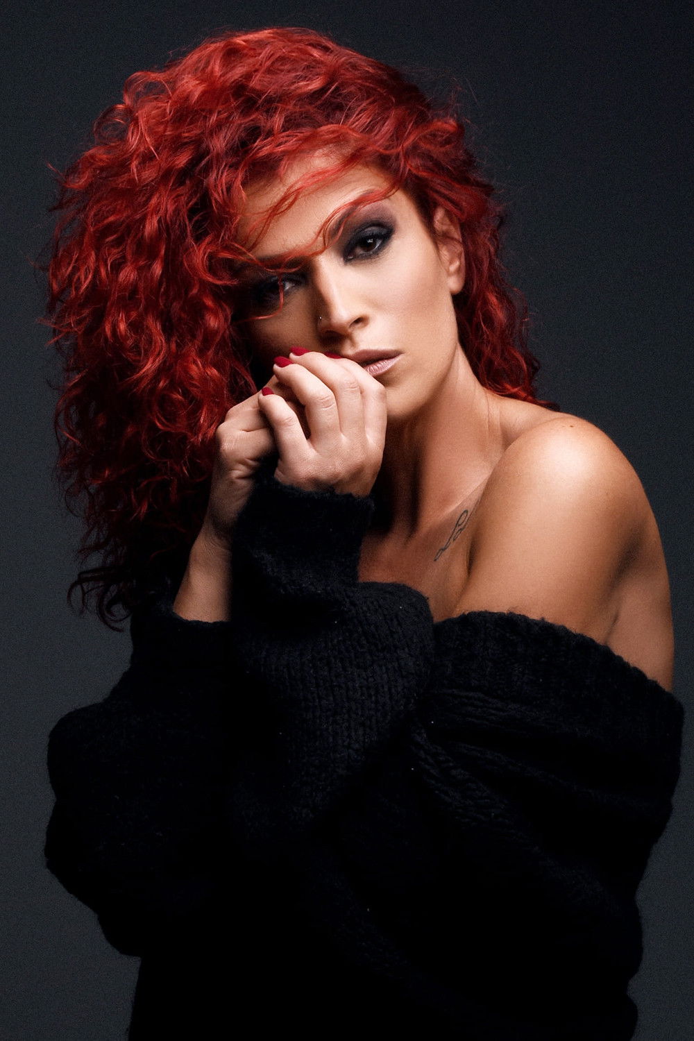 Shengyl Ismaili backdrop