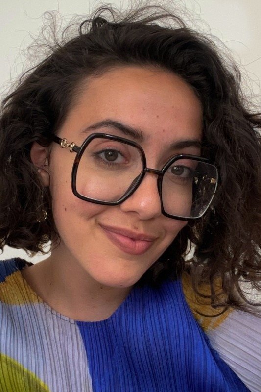 Nadira Amrani backdrop