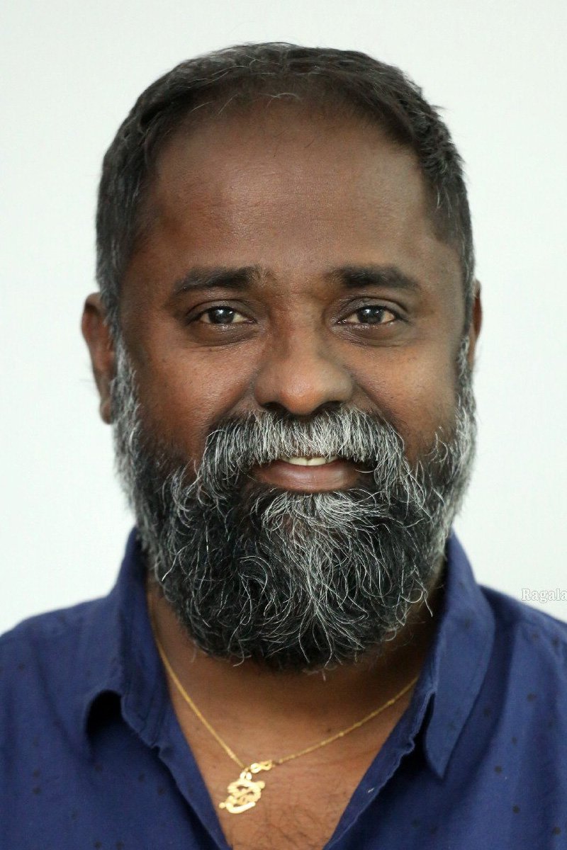 K. V. Guhan backdrop