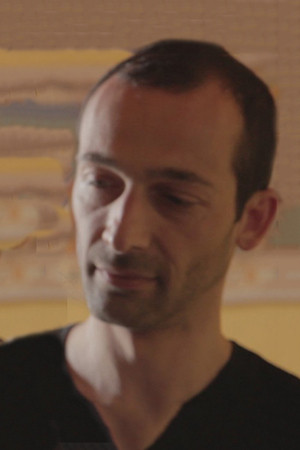 Giorgos Tzouvelekis backdrop