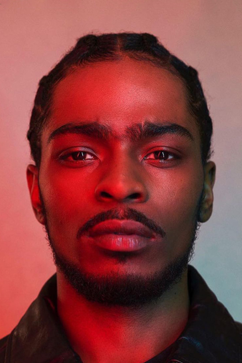 Malcolm Kamulete backdrop