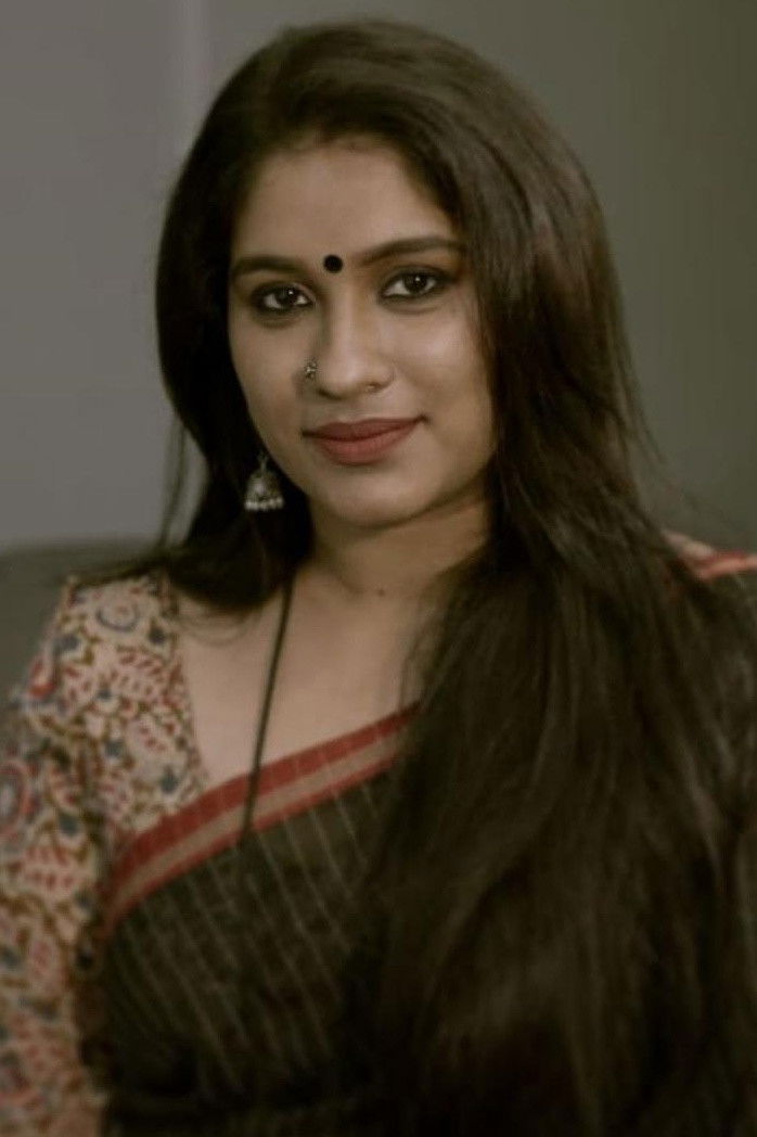 Radhika Radhakrishnan backdrop