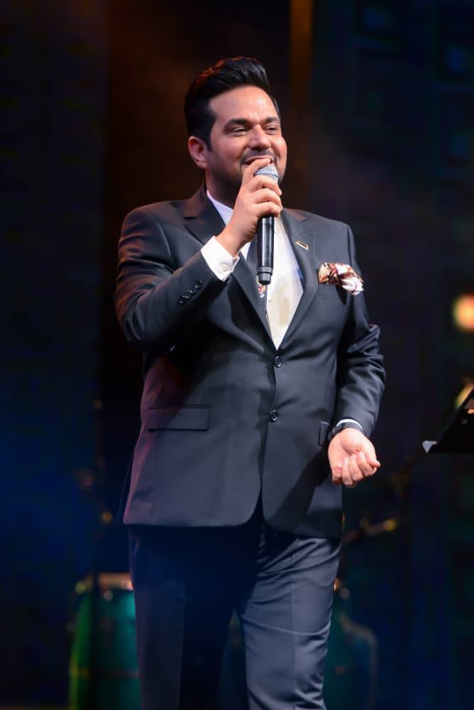 Hatem Al Iraqi backdrop