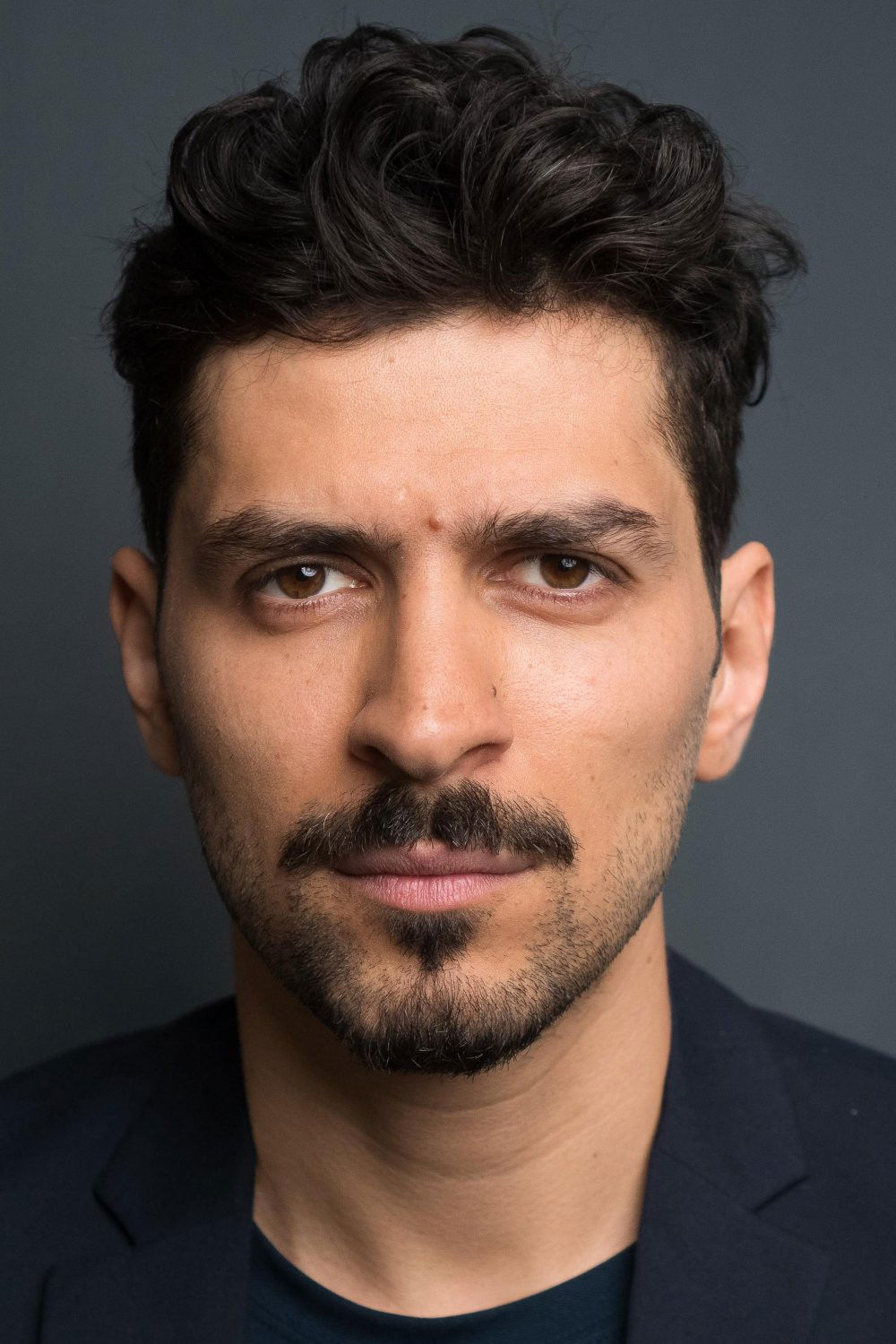 Tourialay Akbari backdrop