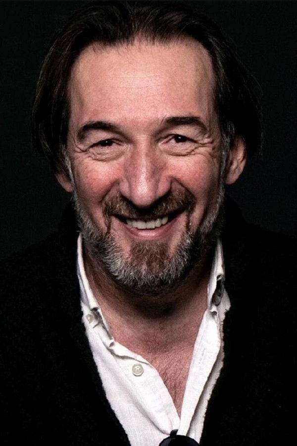 Eroll Bilibani backdrop