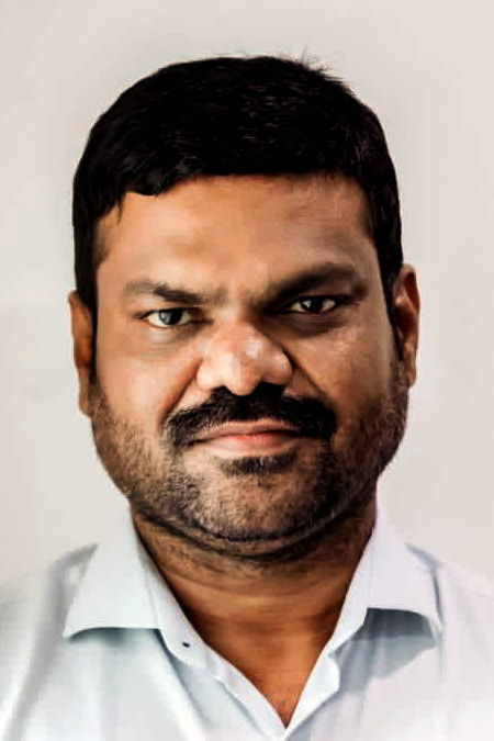 G. K. M. Tamil Kumaran backdrop