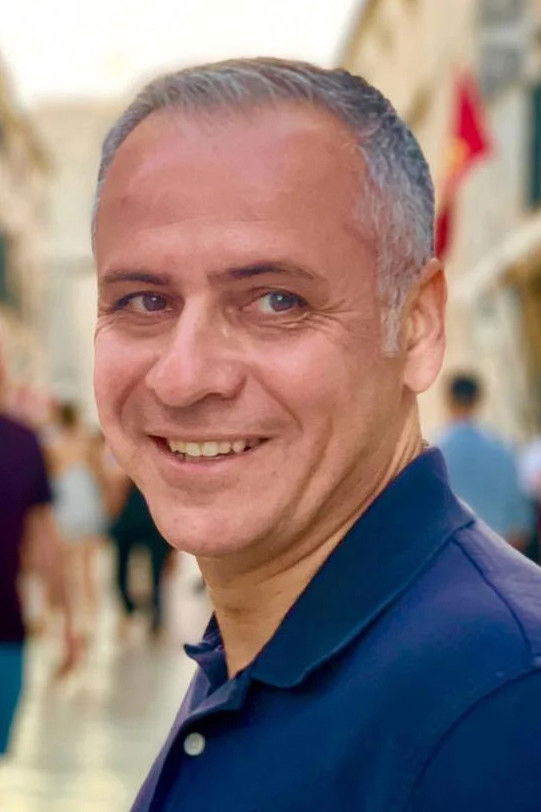 Nikos Christoforou backdrop