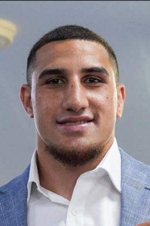 Justis Huni backdrop