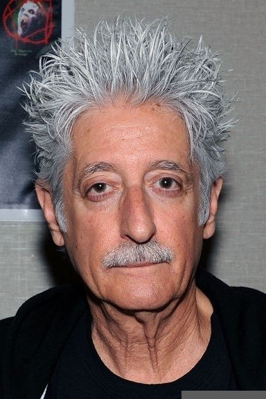 Ted Nikolaou → Tet Nikollaou backdrop