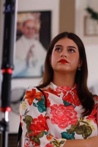 Paola M. Tirado backdrop