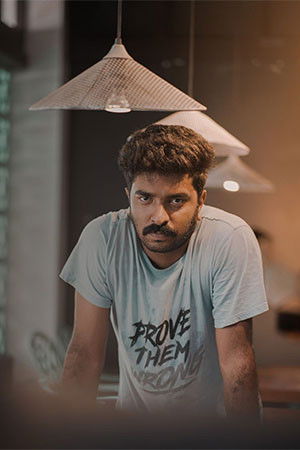 Ashwin E Thayneri backdrop