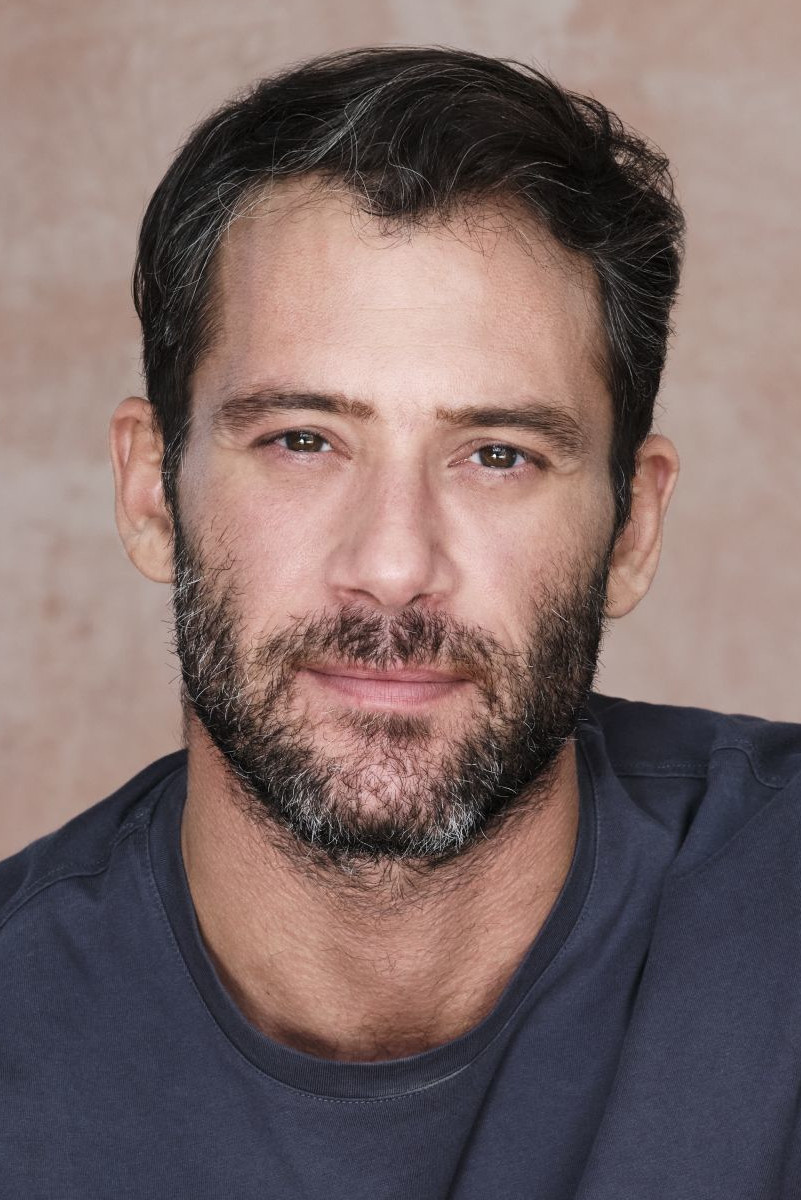 Antinoos Albanis backdrop