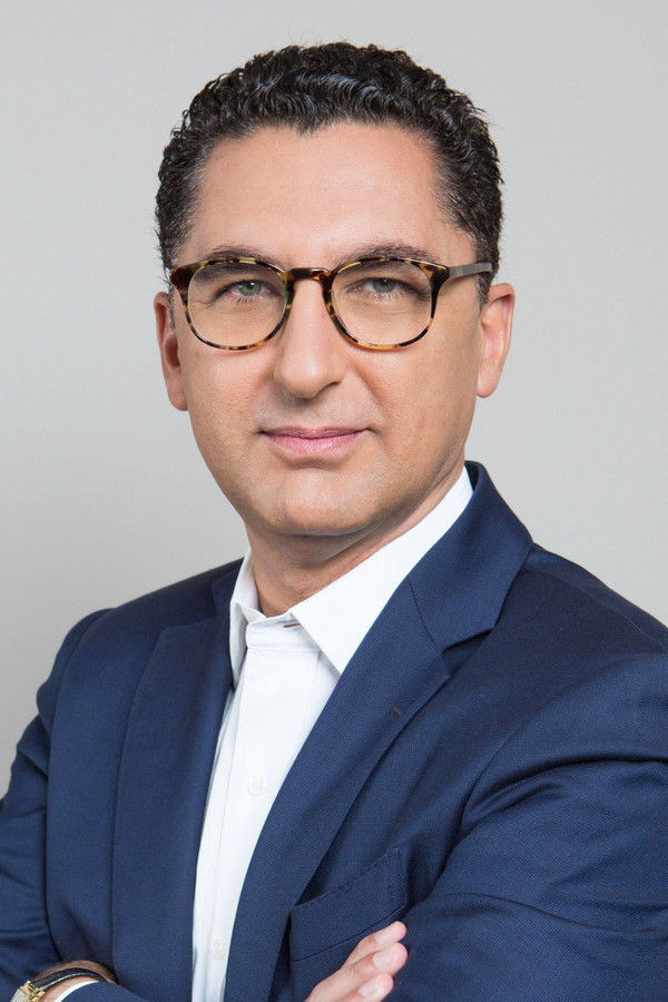 Maxime Saada backdrop