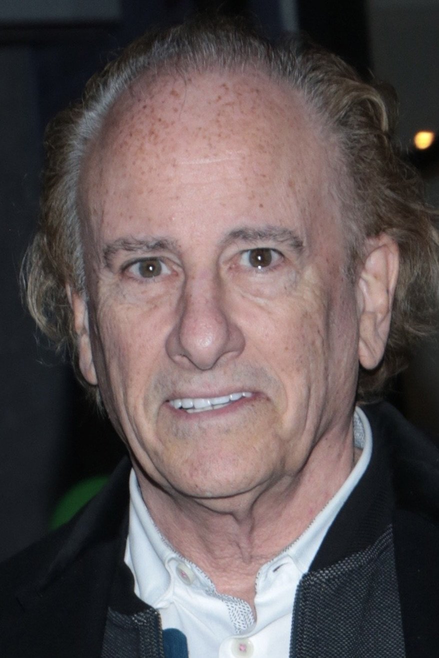 Mark L. Lester backdrop