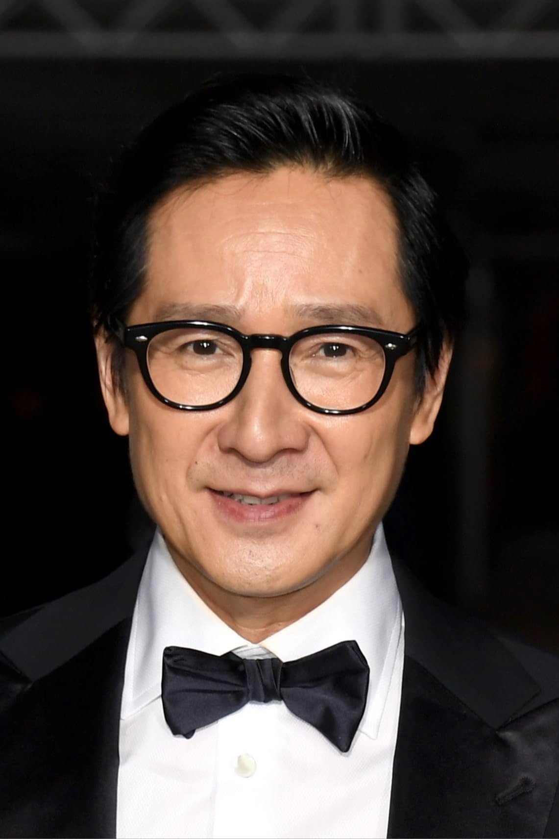 Ke Huy Quan backdrop