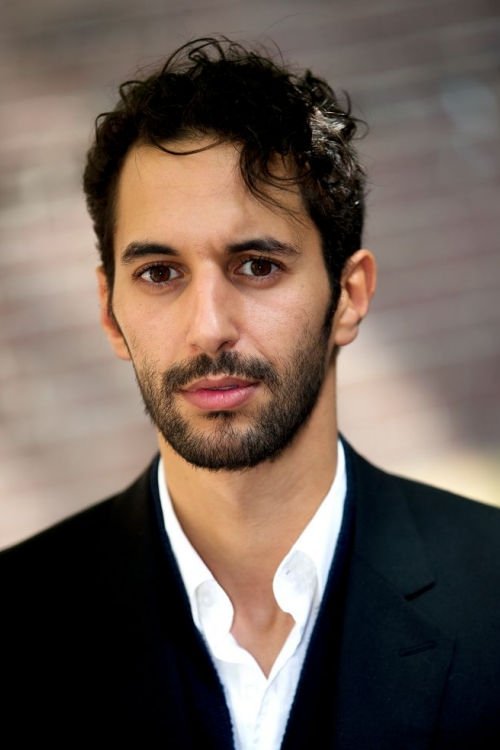 Achmed Akkabi backdrop