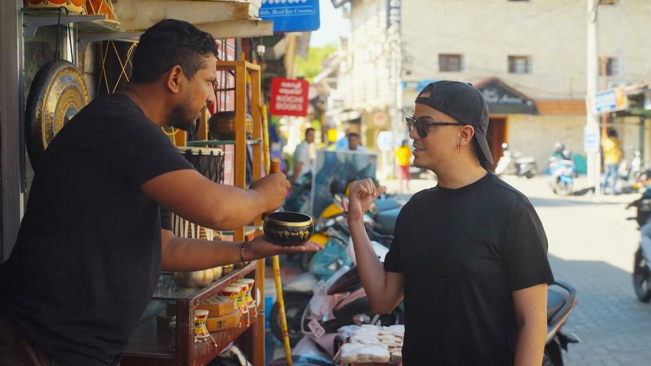 Les voyages de Nicky can be translated to Albanian as Udhëtimet e Nicky-t backdrop