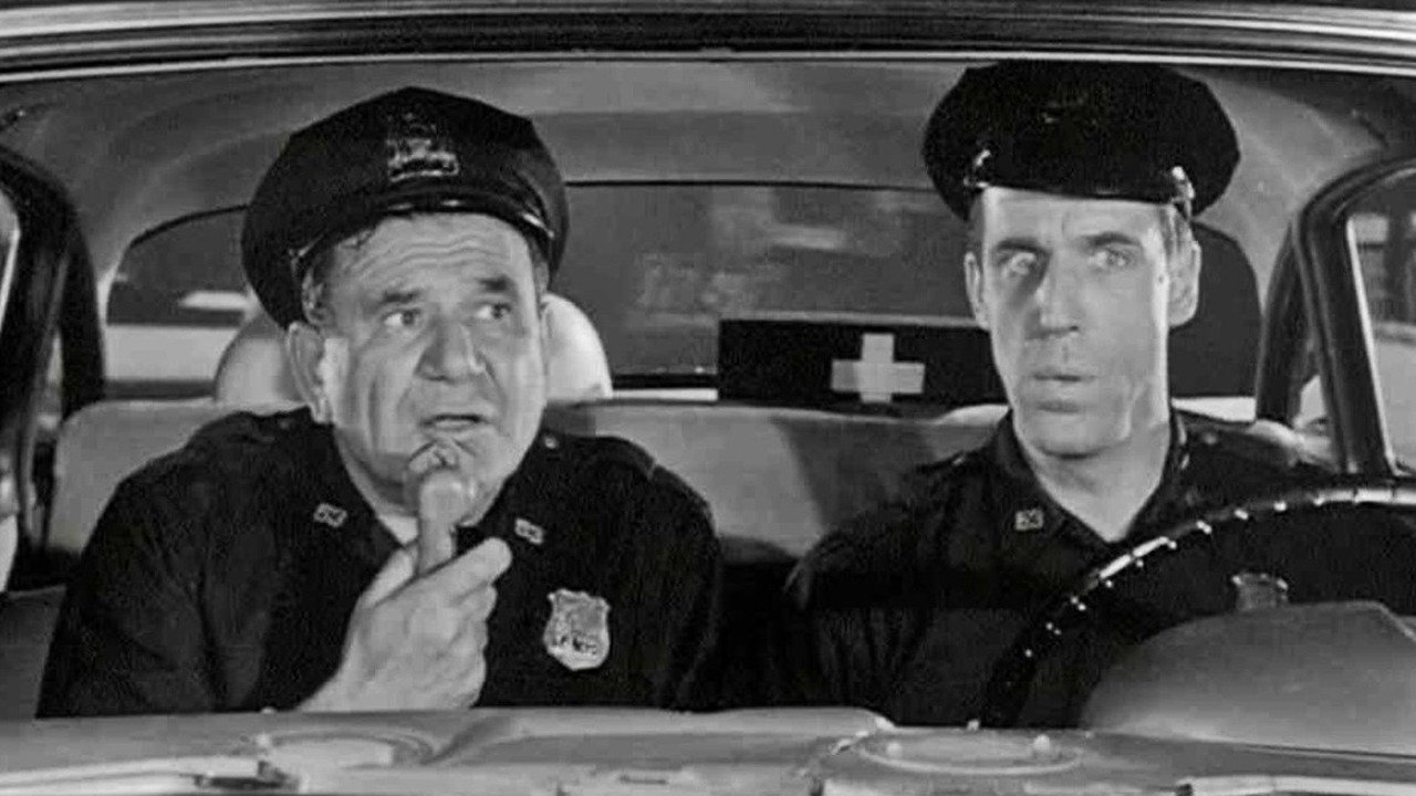 Makina 54, Ku Je? backdrop