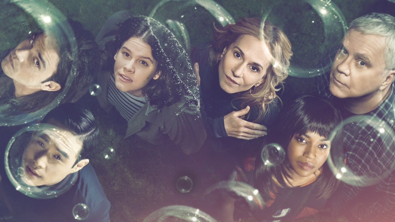 Këtu Dhe Tani backdrop