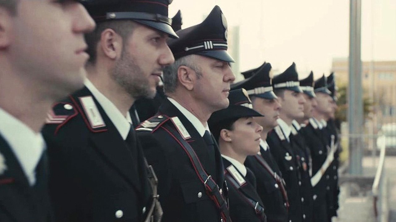 Tregime në uniformë backdrop